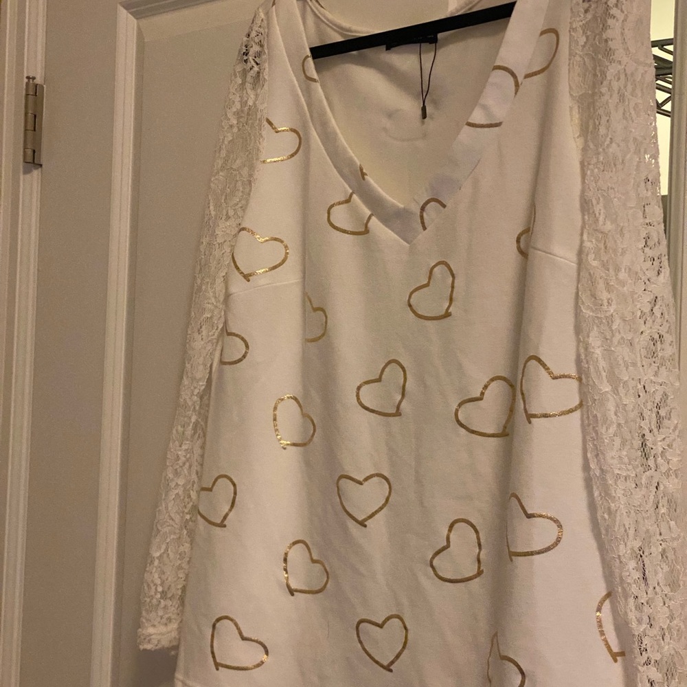 Sheilay, size medium; white feels like sweat-shirt in center and lace on sides